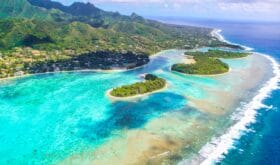 Rarotonga stunning breathtaking views from a plane of beautiful beaches, white sand, clear turquoise water, blue lagoons, green mountains, Cook islands, Pacific islands