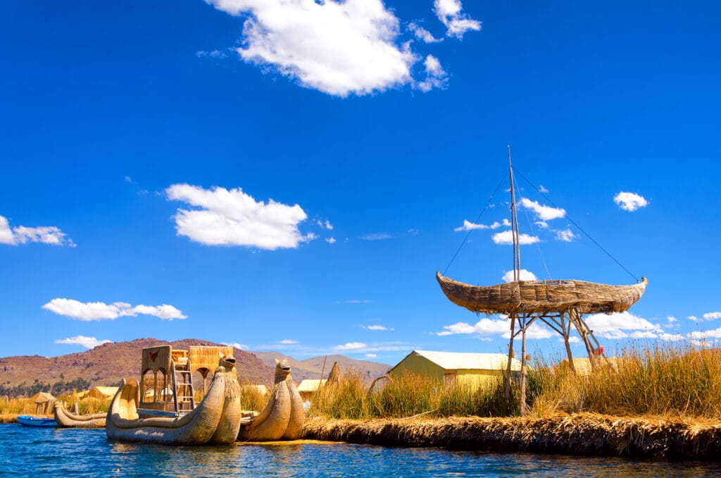 Boats and floating islands made of reeds known as totora on Lake Titicaca in Peru